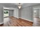 Stylish room with modern lighting and plank flooring, with views into other areas of the home at 3004 Rolling Acres Pl, Valrico, FL 33596
