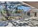 Screened outdoor patio featuring tile floors, a beautiful tree, and lots of space at 3004 Rolling Acres Pl, Valrico, FL 33596
