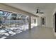 This outdoor patio includes a fireplace, screened enclosure, and access doors at 3004 Rolling Acres Pl, Valrico, FL 33596
