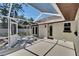 Relaxing screened patio perfect for outdoor entertaining and enjoying the backyard view at 3004 Rolling Acres Pl, Valrico, FL 33596