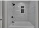 New tile detail in the shower and bath add to the elegant fixtures and design at 3004 Rolling Acres Pl, Valrico, FL 33596