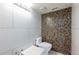 Modern bathroom with a decorative tile accent wall and contemporary fixtures at 3302 W Caracas St, Tampa, FL 33614