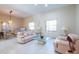 Bright living room with high ceilings, neutral tones, and glass furniture at 3302 W Caracas St, Tampa, FL 33614