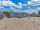 Fenced backyard with a gravel ground and a table with chairs at 3309 Rock Royal Dr, Holiday, FL 34691