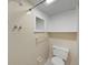 Bathroom with a white toilet, tiles, and shower at 3309 Rock Royal Dr, Holiday, FL 34691