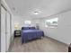 Bright bedroom features two windows, new floors, and closet at 3309 Rock Royal Dr, Holiday, FL 34691