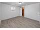 Bright bedroom with hardwood floors, walk-in closet and natural light from windows at 3309 Rock Royal Dr, Holiday, FL 34691