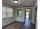 Bright dining area featuring wood-look floors and natural light from the windows at 3309 Rock Royal Dr, Holiday, FL 34691