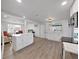 Bright and airy open kitchen featuring white cabinetry, island, and modern appliances at 3309 Rock Royal Dr, Holiday, FL 34691