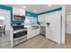 Modern kitchen featuring stainless steel appliances, white cabinetry, and updated fixtures at 3309 Rock Royal Dr, Holiday, FL 34691