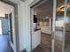 Bright living room with new flooring and white kitchen island, flowing layout for entertaining at 3309 Rock Royal Dr, Holiday, FL 34691