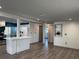 Spacious living area with modern lighting and a seamless flow into the kitchen at 3309 Rock Royal Dr, Holiday, FL 34691