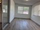 Bright living room with hardwood floors and natural light from windows at 3309 Rock Royal Dr, Holiday, FL 34691