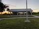 Covered picnic area with tables, perfect for outdoor gatherings and enjoying meals in a scenic setting at 3309 Rock Royal Dr, Holiday, FL 34691