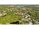Aerial view highlighting property's proximity to green spaces and community amenities at 3579 Landmark Trl, Palm Harbor, FL 34684