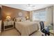 This bedroom features comfortable bedding, decorative wall art, and matching nightstands for a balanced and restful space at 3579 Landmark Trl, Palm Harbor, FL 34684