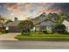 Charming single-story home with well-manicured lawn, mature landscaping, and a two-car garage at 3579 Landmark Trl, Palm Harbor, FL 34684