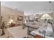 Spacious living room showcasing a large sectional couch, bar area, and open floor plan at 3579 Landmark Trl, Palm Harbor, FL 34684