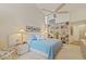The main bedroom features a high ceiling, a bookcase, neutral colors, and coordinated lamps to make the room serene at 3579 Landmark Trl, Palm Harbor, FL 34684