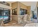 Entertain with ease at this outdoor bar featuring granite countertops and seating for two guests at 3579 Landmark Trl, Palm Harbor, FL 34684