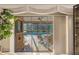 Covered patio overlooking the pool area, perfect for relaxation and entertaining guests at 3579 Landmark Trl, Palm Harbor, FL 34684