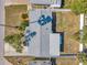Overhead view of a house showcasing a new roof, fenced yard, and landscaping, and a nice outdoor living area at 3624 Hendrix St, New Port Richey, FL 34652