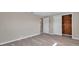 Bedroom featuring a closet with wood-look door and durable floors at 3624 Hendrix St, New Port Richey, FL 34652