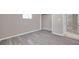 Bedroom featuring durable flooring and a closet at 3624 Hendrix St, New Port Richey, FL 34652