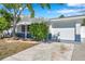 Charming single-story home featuring a well-maintained yard, attached garage, and inviting curb appeal at 3624 Hendrix St, New Port Richey, FL 34652