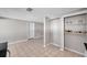 Open-concept kitchen boasts shelving and neutral tile flooring at 3624 Hendrix St, New Port Richey, FL 34652
