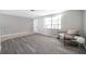 Inviting living room with large window, creating a naturally lit and comfortable atmosphere at 3624 Hendrix St, New Port Richey, FL 34652