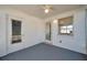 Enclosed sunroom featuring white walls, gray floor, and ample natural light creating a cozy and inviting space at 3624 Hendrix St, New Port Richey, FL 34652