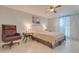 Bedroom featuring a comfortable bed, stylish furniture, and large windows for ample natural light at 3633 Richboro Dr, Holiday, FL 34691