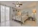 Inviting bedroom with a comfortable bed, stylish decor, and large windows for natural light at 3633 Richboro Dr, Holiday, FL 34691