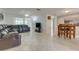 Open-concept living room with comfortable seating, and bright natural light at 3633 Richboro Dr, Holiday, FL 34691
