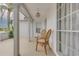 Covered front porch showcasing classic decor, seating, and a glimpse of the home's exterior at 3633 Richboro Dr, Holiday, FL 34691