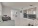 Bright sun room with sliding glass doors and a tiled floor, ideal for relaxing and entertaining at 3633 Richboro Dr, Holiday, FL 34691