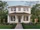 Charming two-story home with a welcoming front porch, landscaped garden, and beautiful curb appeal at 445 36Th N Ave, St Petersburg, FL 33704