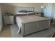 Comfortable bedroom with a queen sized bed and matching nightstands at 4725 Cove Cir # 810, St Petersburg, FL 33708