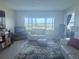 Well-lit living room with view of the water from the large window at 4725 Cove Cir # 810, St Petersburg, FL 33708