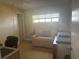 Cozy office space featuring a comfortable sofa and natural light at 4725 Cove Cir # 810, St Petersburg, FL 33708