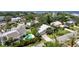 Aerial view of homes with manicured lawns, pools, lush greenery, and waterfront access at 4912 W Bay Way Dr, Tampa, FL 33629