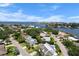 Scenic aerial view of homes, with waterfront views, mature trees, and blue skies at 4912 W Bay Way Dr, Tampa, FL 33629