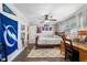 Bright bedroom with ceiling fan and a desk beside a window providing natural light at 4912 W Bay Way Dr, Tampa, FL 33629