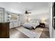 Relaxing main bedroom with a comfortable bed, ceiling fan, and plenty of natural light at 4912 W Bay Way Dr, Tampa, FL 33629