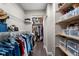 Walk-in closet features custom shelving and plenty of storage space for clothes and accessories at 4912 W Bay Way Dr, Tampa, FL 33629