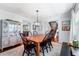 Elegant dining room with a chandelier, large windows, and seating for six at 4912 W Bay Way Dr, Tampa, FL 33629