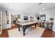 Spacious game room features a pool table, hardwood floors, and plenty of natural light at 4912 W Bay Way Dr, Tampa, FL 33629