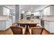 Bright kitchen featuring an island, white cabinets, stainless steel appliances, and hardwood floors at 4912 W Bay Way Dr, Tampa, FL 33629