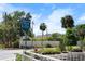Beach Park Isle sign with lush landscaping, blue sky, and nearby homes at 4912 W Bay Way Dr, Tampa, FL 33629